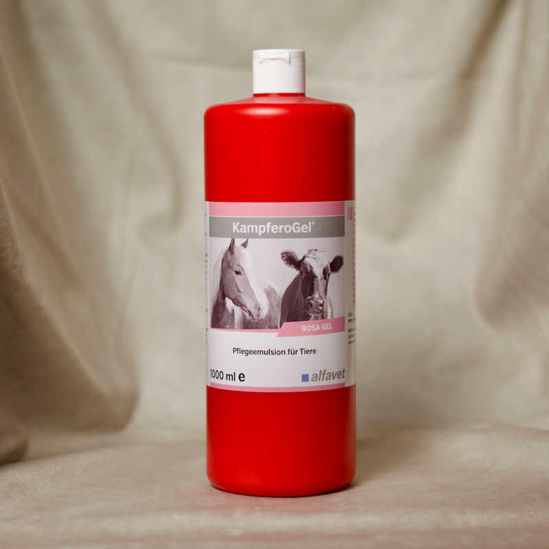 Rote Flasche mit Massageöl. Bild zeigt Pferd und Kuh.