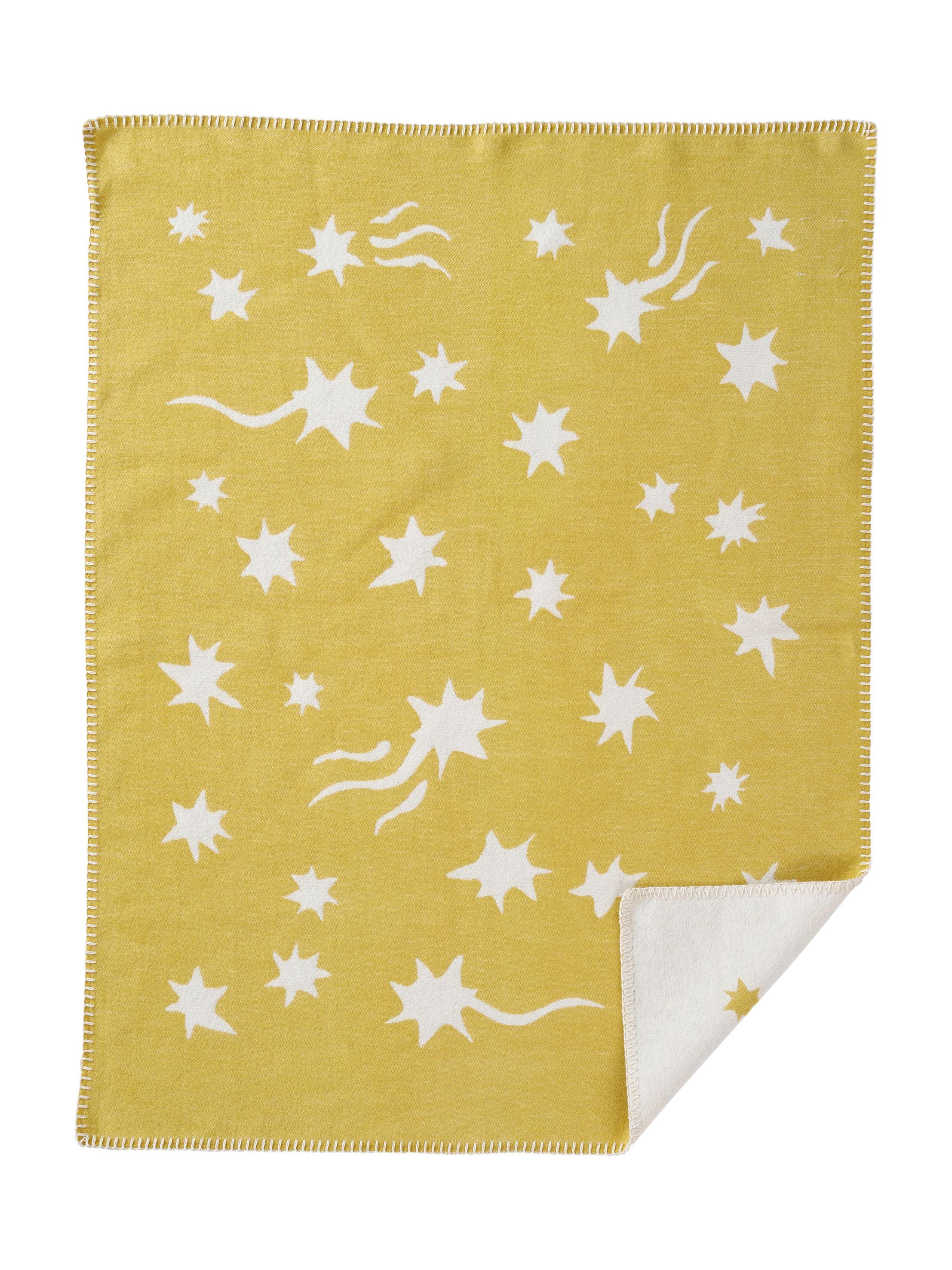 Gelbe Kuscheldecke mit weißen Stern- und Kometenmotiven, weiche wendbare Wolldecke mit kontrastierendem Rand.