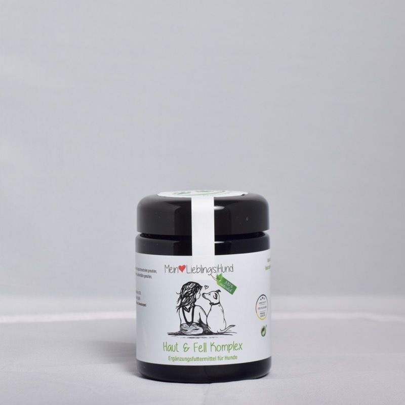 Mein LieblingsHund Haut & Fell Komplex Ergänzungsfuttermittel für Hunde in dunklem Kunststoffdose mit Etikett und Illustration von Hund und Mensch
