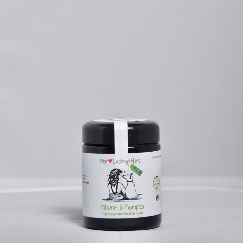 Schwarzes Schraubglas von „Mein LieblingsHund“ mit Etikett „Vitamin B Komplex“, Illustration von Mensch und Hund, Ergänzungsfuttermittel für Hunde.