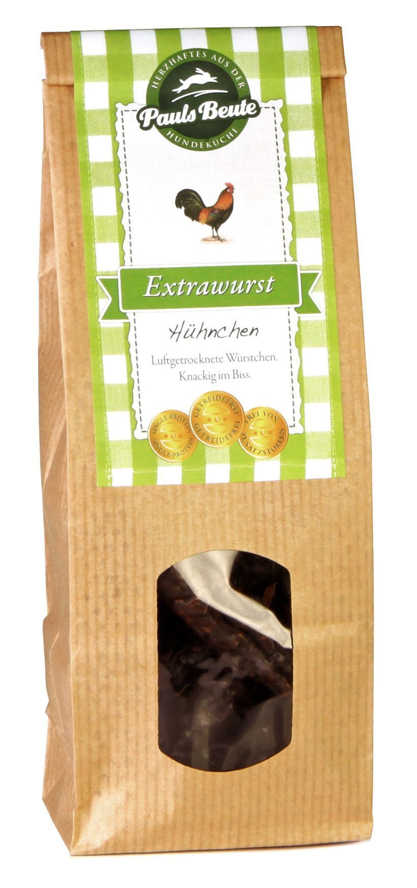 Pauls Beute Extrawurst Hähnchen in brauner Papierverpackung mit grün-weißem Etikett und Sichtfenster, luftgetrocknete Hundewurst aus Hühnerfleisch.