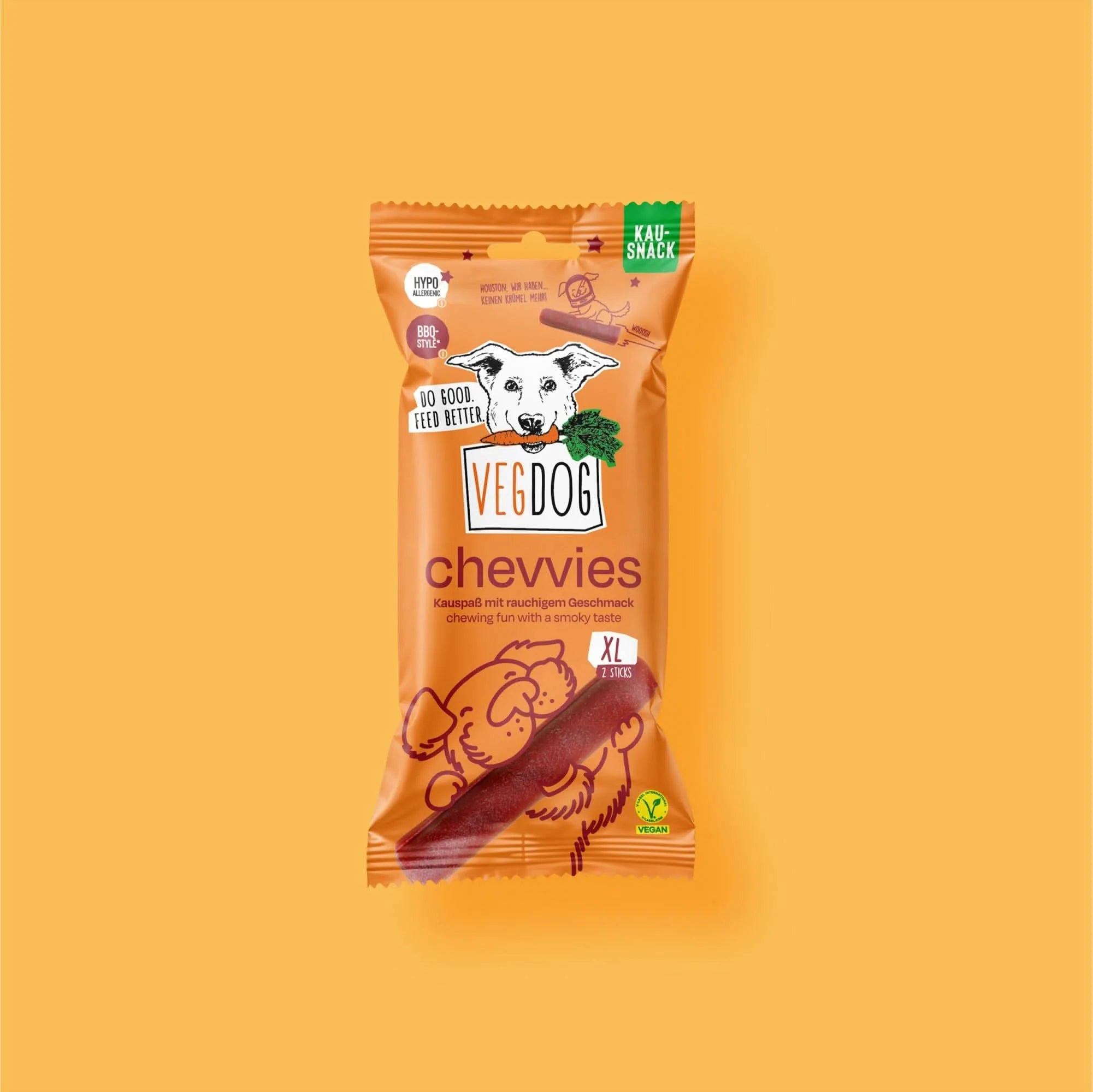 VEGDOG Chevvies XL – veganer Kausnack für Hunde mit rauchigem BBQ-Geschmack in orangefarbener Verpackung
